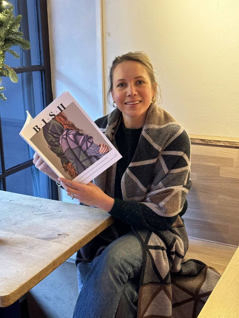 Genevieve in a local cafe with the Bish Magazine