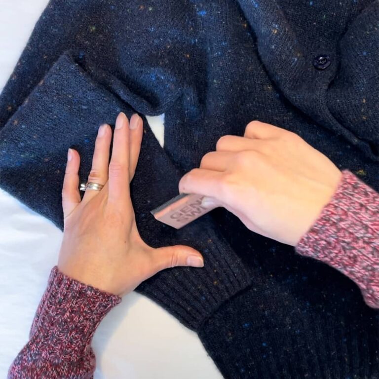 Using Genevieve Sweeney cedarwood comb to lightly clean Maddis Cardigan